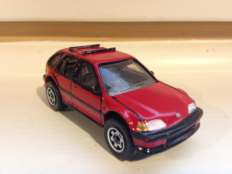 B and C pillars created from a red straw from a can of PB Blaster, filled the sunroof with super glue and baking soda, shaved off the spoiler, and made the roof rack with paper clips.